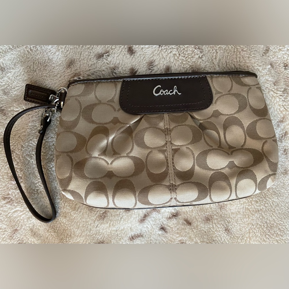 Coach large wristlet in signature C pattern